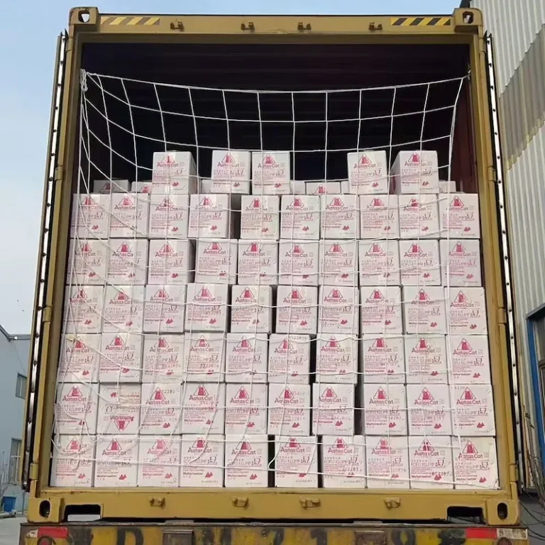 Master cartons of tofu cat litter carefully floor-loaded and stacked inside a shipping container to maximize space and reduce transportation costs.